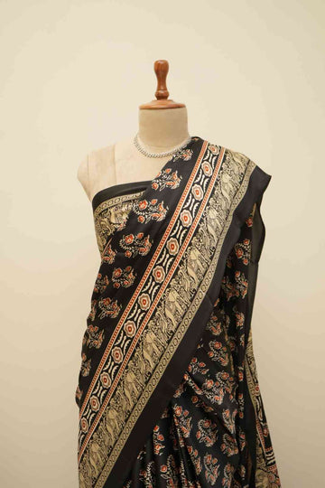 Black floral Ajrakh modal silk saree with ethnic print