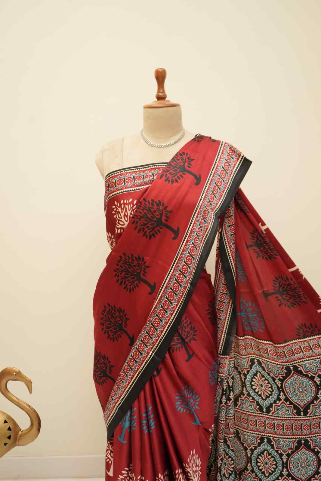 Red modal silk saree with classic Ajrakh patterns
