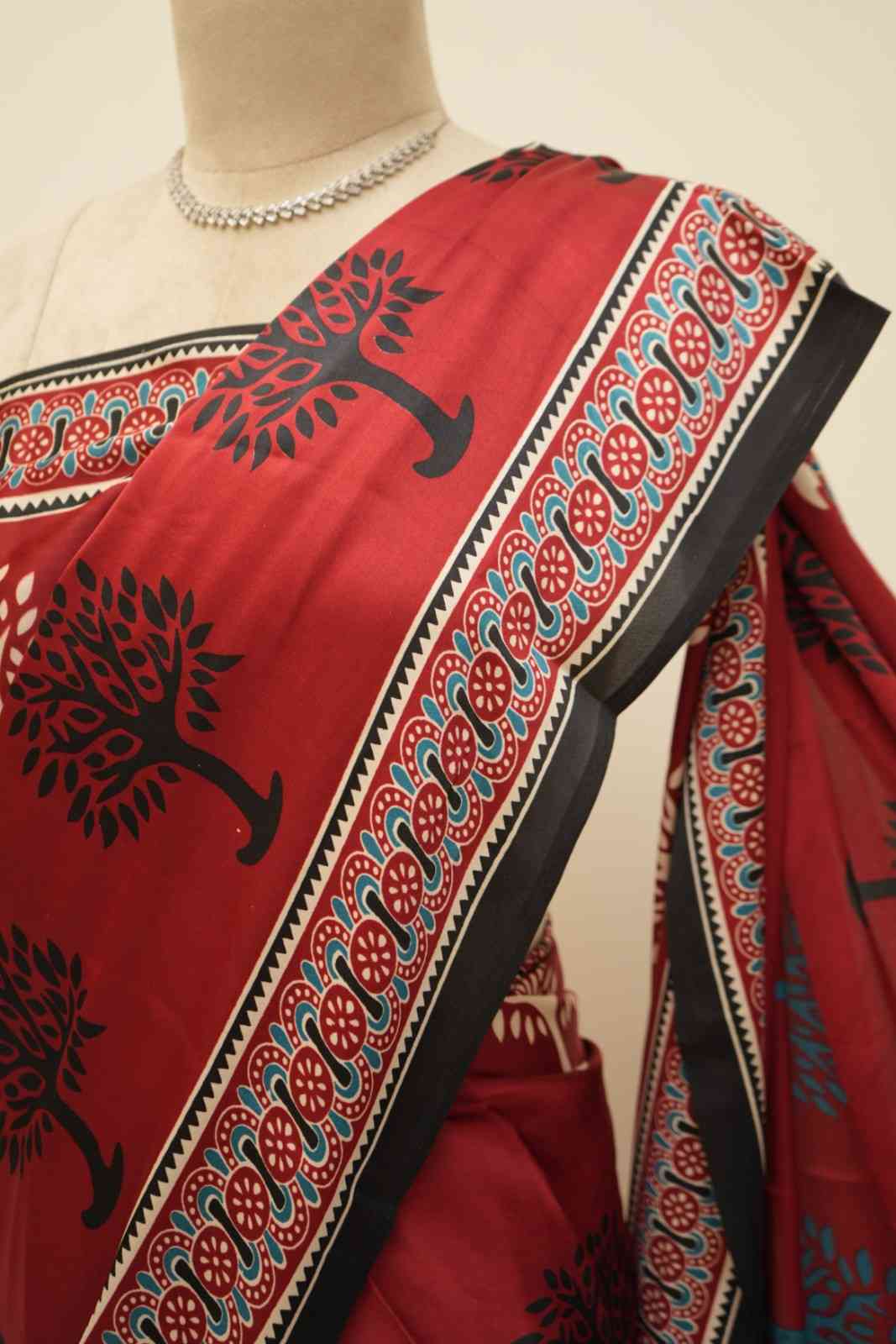 Red modal silk saree with classic Ajrakh patterns