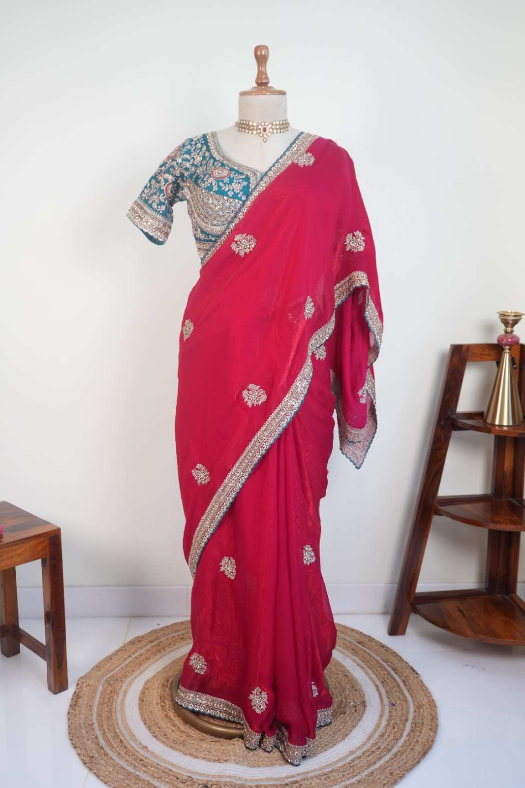 Stitched blouse with red festive saree and embellished border, vibrant wedding and festive party wear saree for women