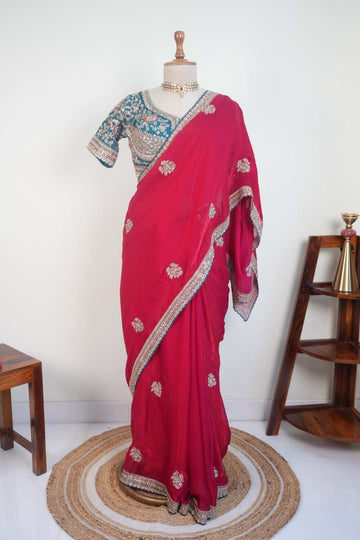 Stitched blouse with red festive saree and embellished border, vibrant wedding and festive party wear saree for women