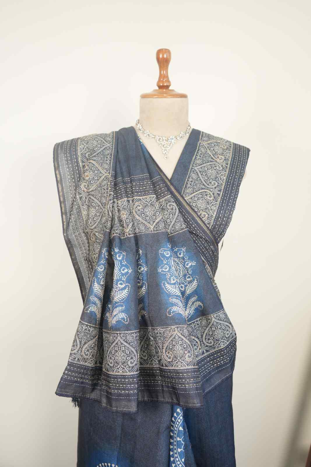 This blue cotton saree with traditional prints is a perfect everyday wear saree for a stylish ethnic look.