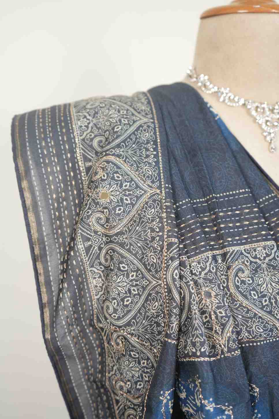 This blue cotton saree with traditional prints is a perfect everyday wear saree for a stylish ethnic look.