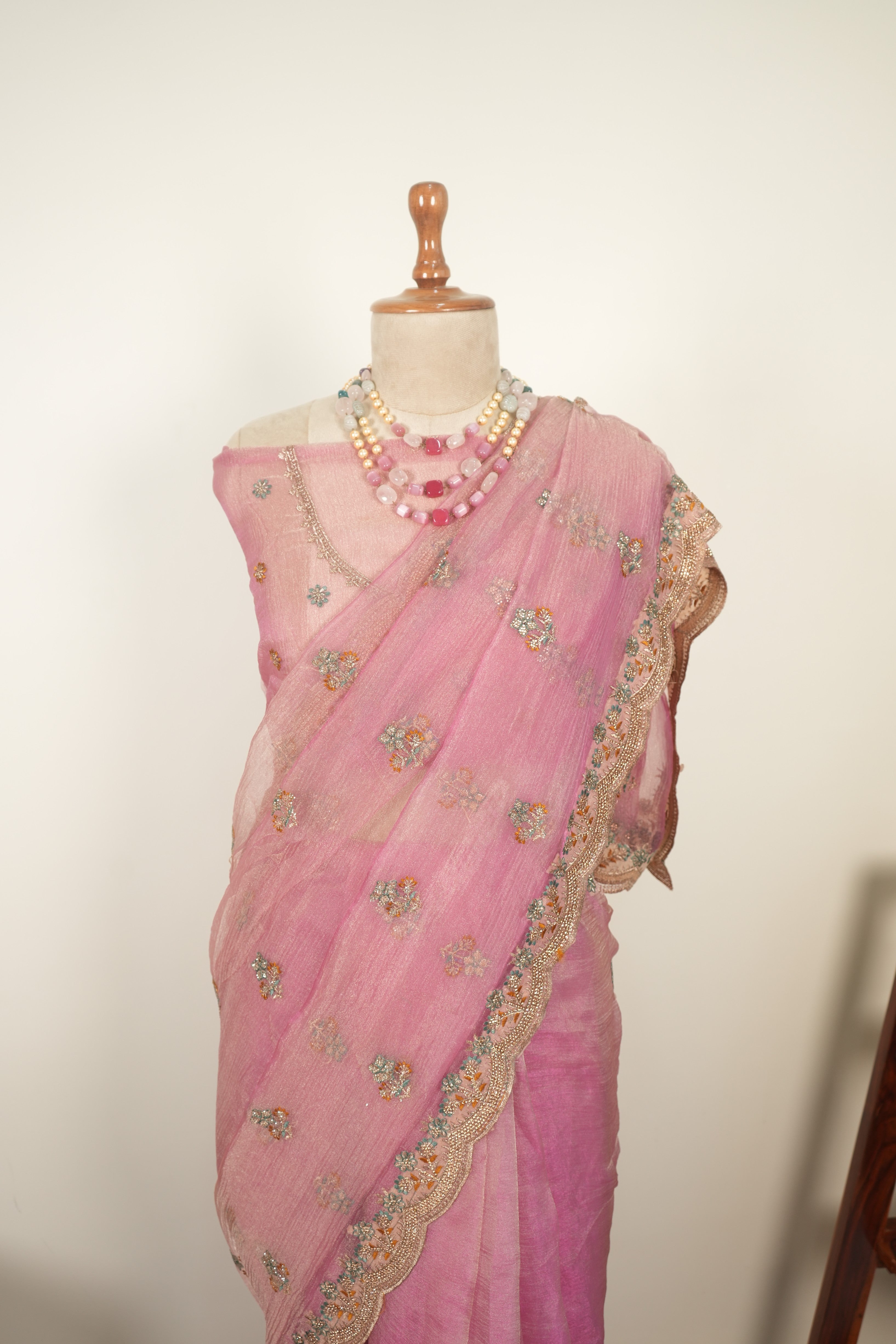 Pink crushed organza saree with zari work and gentle jarkan embellishments, elegant festive and party wear saree for women