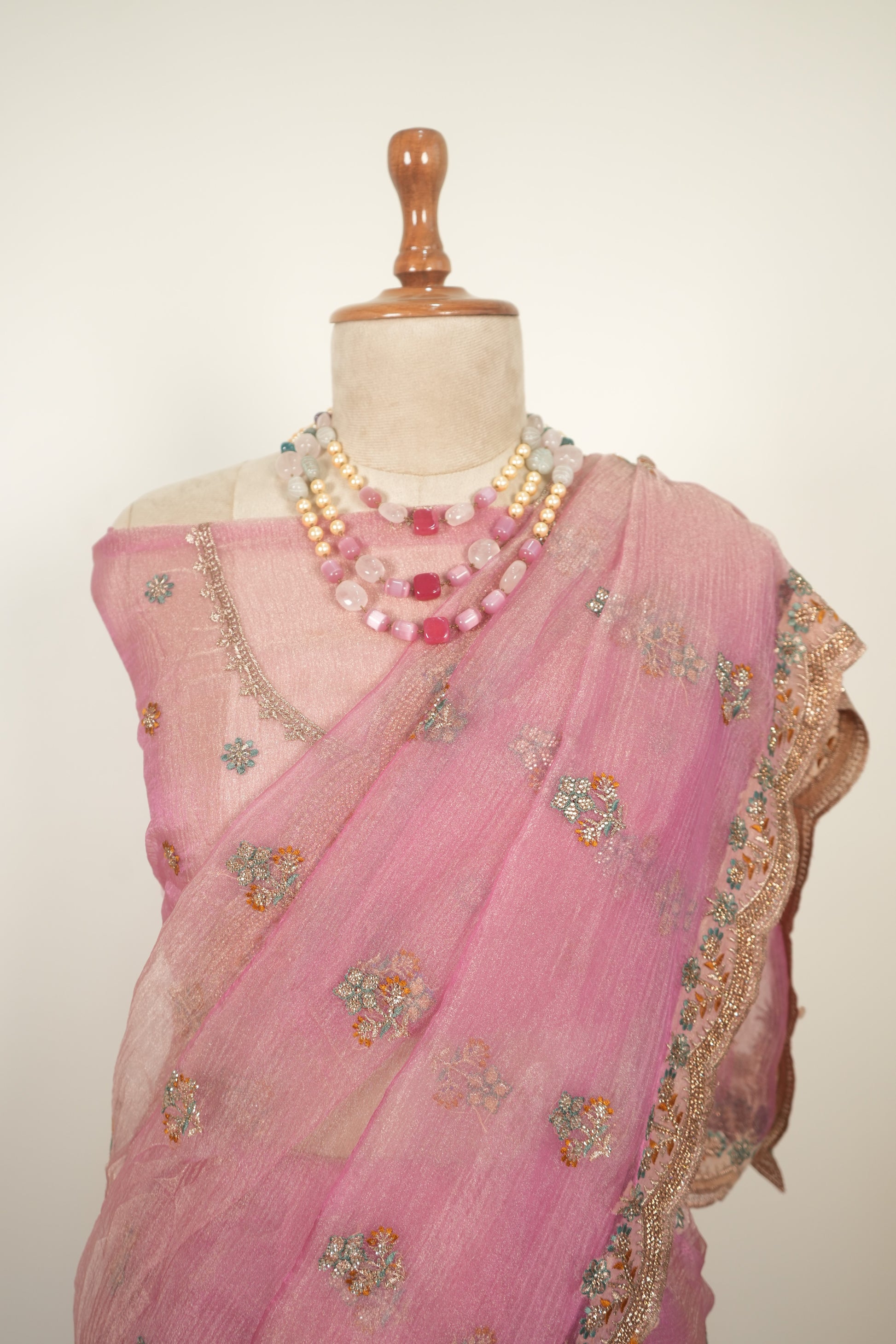 Pink crushed organza saree with zari work and gentle jarkan embellishments, elegant festive and party wear saree for women