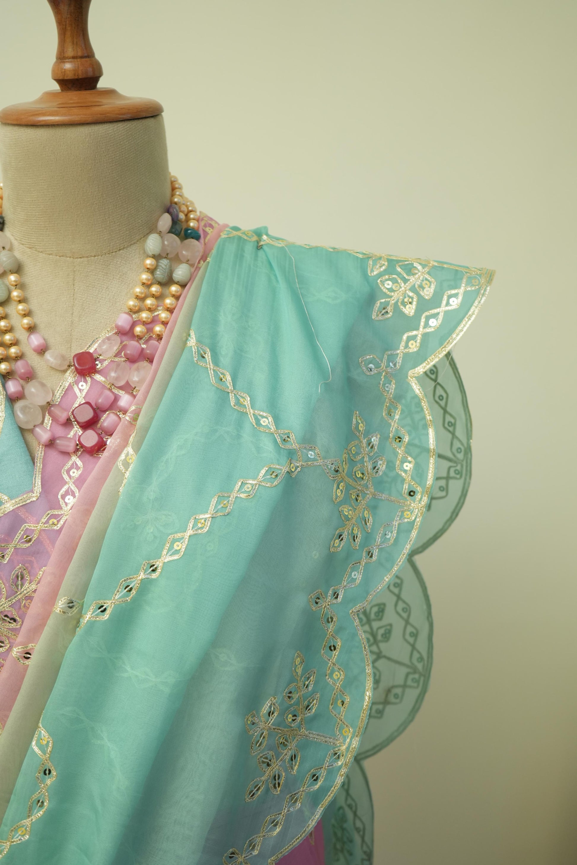This ombre style saree with gradient tones and gotta patti embroidery is ideal as an occasion wear saree for women.