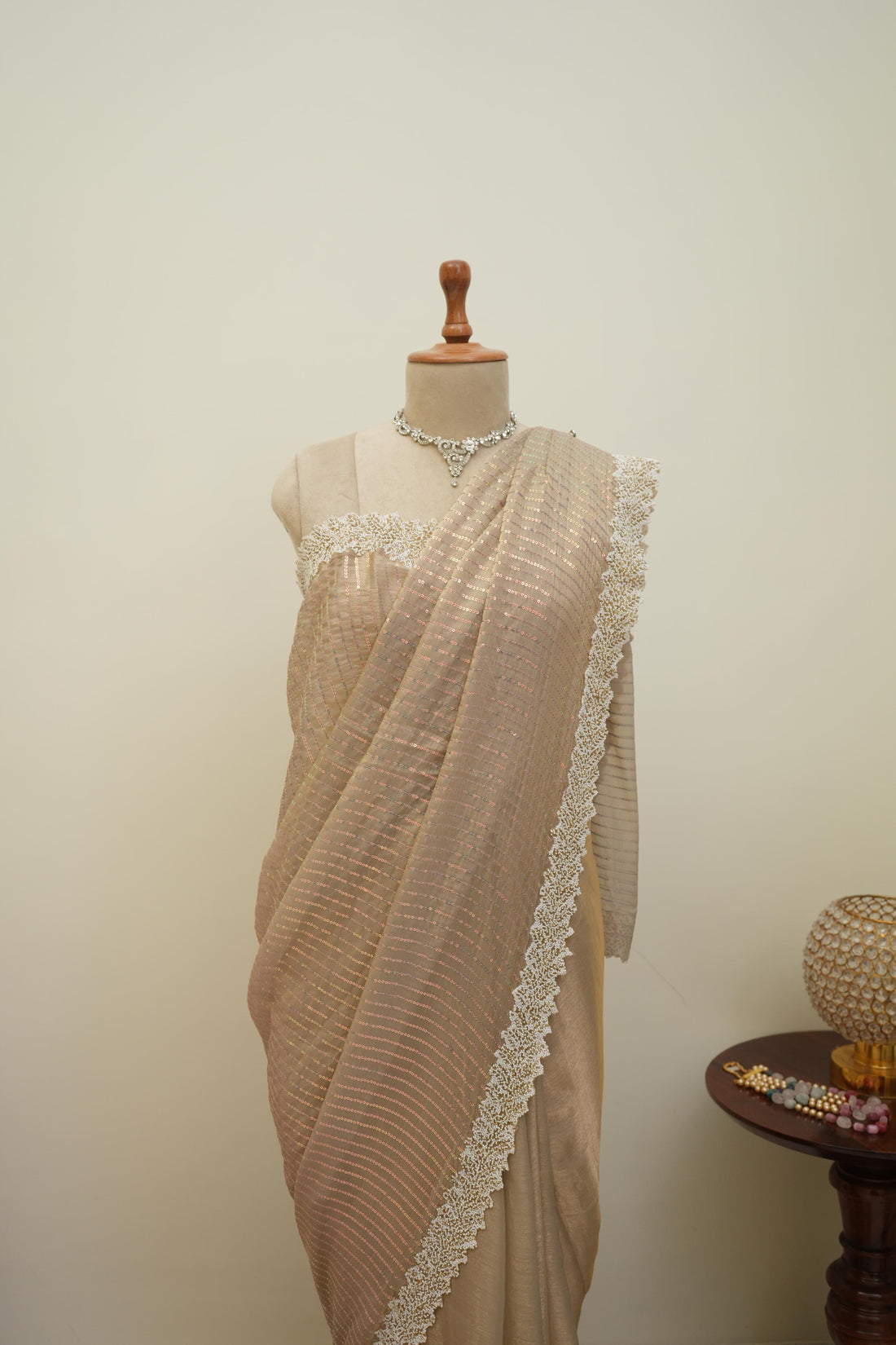 Beige sequin work saree with shimmer detailing and lace border, graceful party wear and occasion saree for women