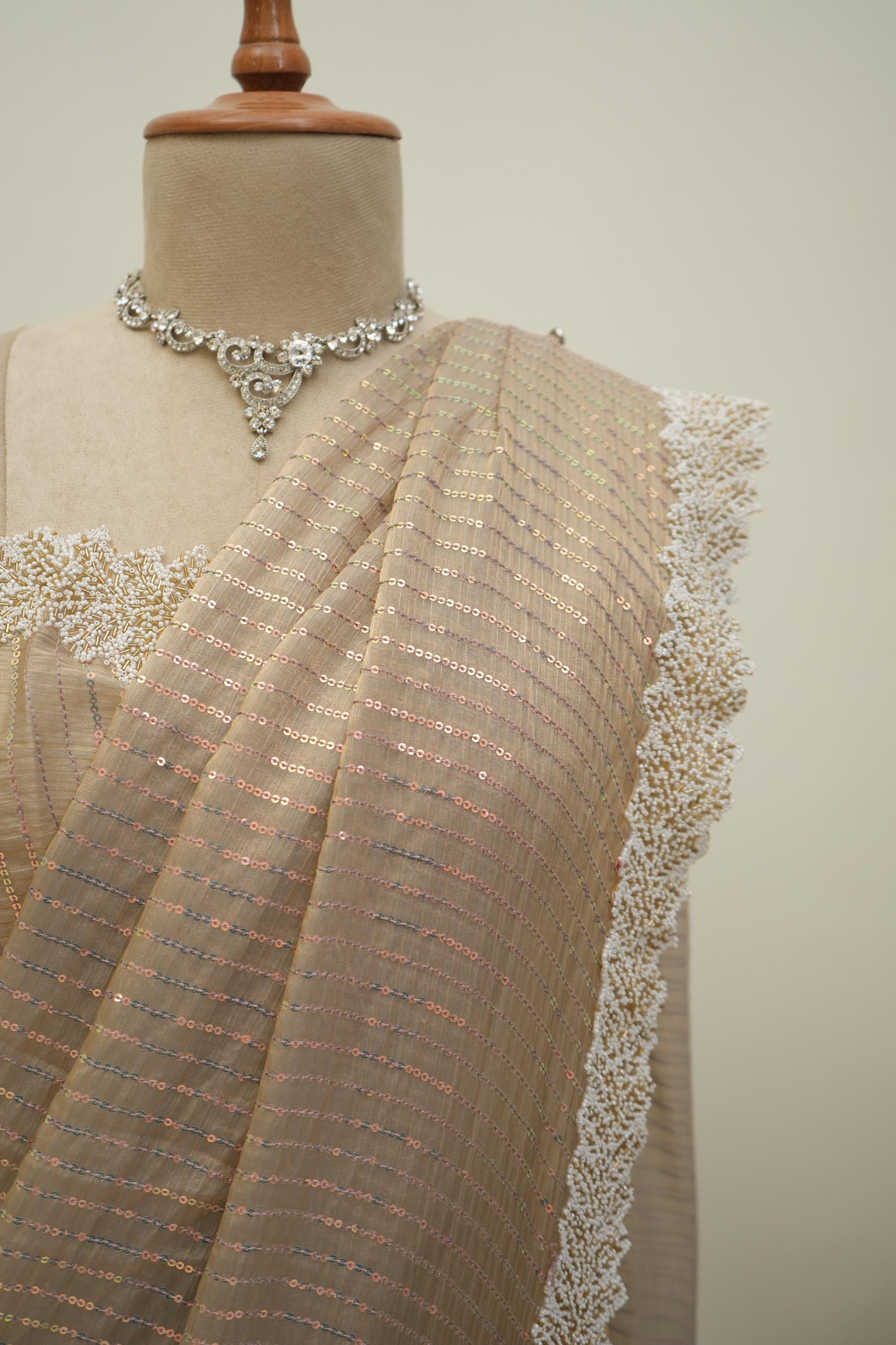 Beige sequin work saree with shimmer detailing and lace border, graceful party wear and occasion saree for women