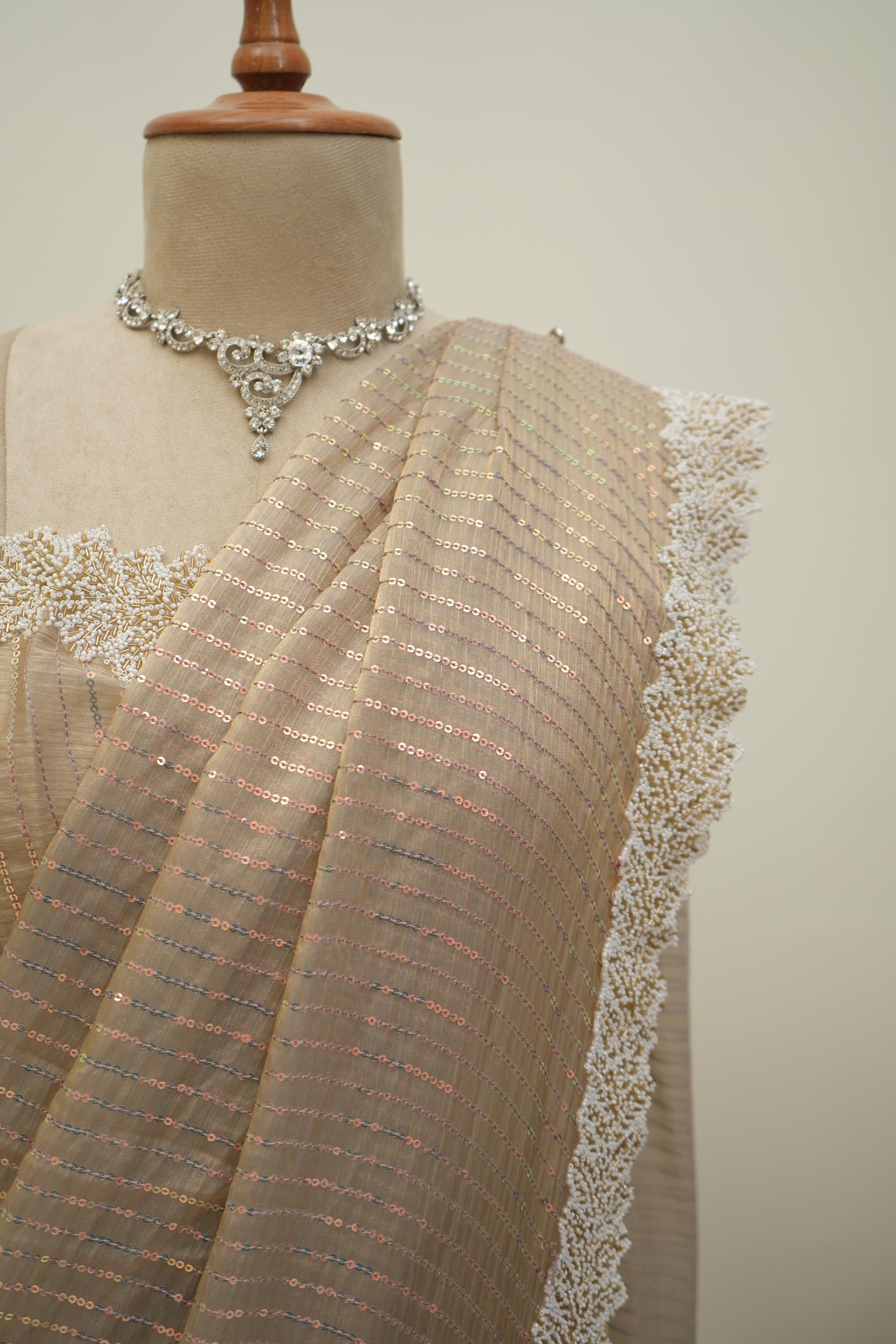 Beige sequin work saree with shimmer detailing and lace border, graceful party wear and occasion saree for women